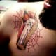 Color Tattoo of a Candle in a Coffin