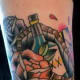 Color Tattoo of a Bottle in a Coffin