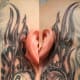 Eight ball tattoos behind the ears.