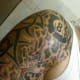Eight ball shoulder tattoo.