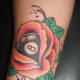 Eight ball inside a rose.
