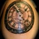 Clock tattoo.
