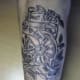 Clock tattoo with the text, "Time stops for no one."