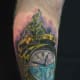 Alarm clock tattoo with pouring water.