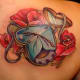 Heart-shaped clock tattoo.