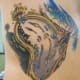 Melting clock tattoo.