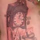 Exploding grandfather clock tattoo.
