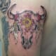 A bull skull with flowers.