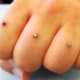Finger dermal piercing
