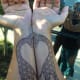 Two giraffes shaped into a heart when arms placed together.