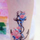 Anchor and flower tattoo