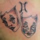 This tattoo focuses on the masks and eliminates the text.