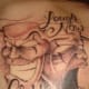 The crying face is particularly expressive in this tattoo.