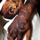 Lion hand tattoo