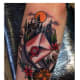 Castle and letter tattoo