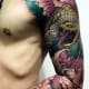 Yellow Japanese snake tattoo