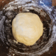 Add in sugar, shortening, salt, egg, and flour. Mix well. Cover with a cloth and allow dough to rise in a warm place so that it doubles in bulk (approximately 1 hour).