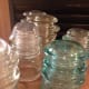 Glass insulators are scattered throughout the museum. Because of their unique appeal, the museum also sells them. Crafters often used them.