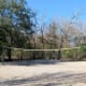 Volleyball area near covered picnic tables in the park