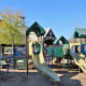 A portion of the children’s playground with the pavilion in the background