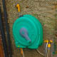This is my Hozelock reel hanging on the wall, with various attachments - a spray head (above) and a garden sprinkler (below)