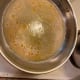 The wine doesn't take as long to heat as the pot of water.