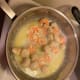 The shrimp turn pink and curl inward and the scallops go from translucent to white and become more firm. Remember, do not over cook the seafood or it will become rubbery.