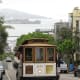 San Francisco cable car with Alcatraz Island in background