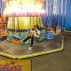 Swing Ride in the game room Austin's Park and Pizza Pflugerville TX
