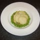 Scalloped potatoes are laid on top of the carrot and parsnip mash