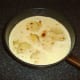 Pamesan cheese is melted over scalloped potatoes