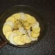 Potato and onion arranged in the pan and seasoned