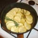 Vegetable stock is added to cover the potatoes
