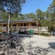 The visiter's center is a couple miles into the park. There are bathrooms with running water, a bike repair station, and a gift shop.