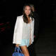 Layer with soft colors for spring and summer. Jamie Chung in mint shorts and a white blazer.