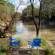 Blue chairs in the park by Cypress Creek