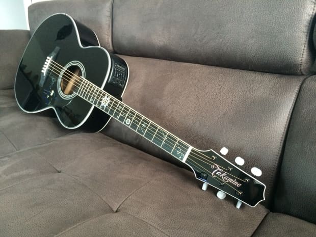 small black acoustic guitar