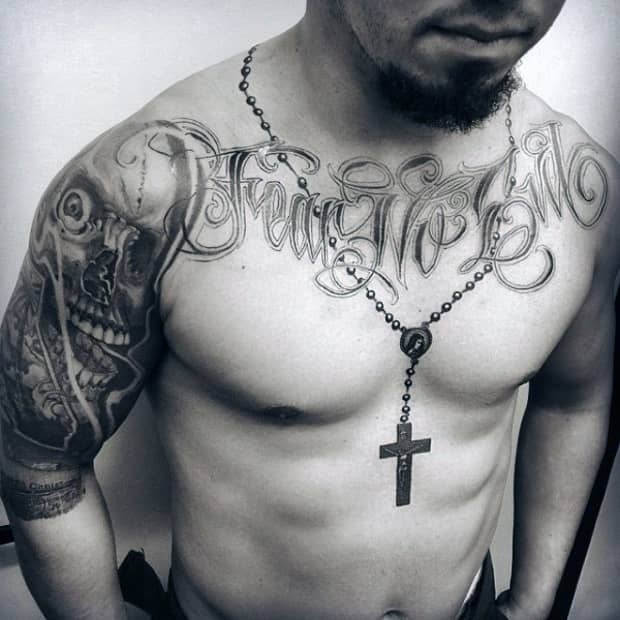 praying hands with rosary tattoo on chest