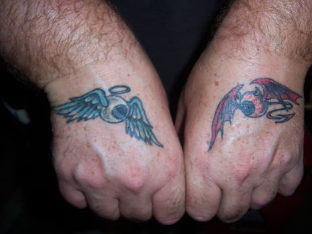 181 Tattooz Studio Angel wings Tattoo mostly are done on both hands showing positive aspects on one hand and negative aspects on other but in the above design Angel wings are