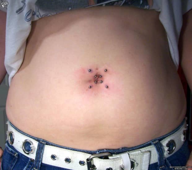 belly button piercing on a fat person