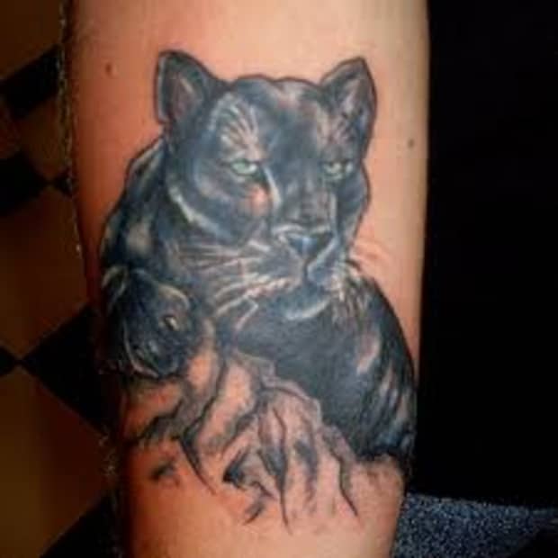 black panther tattoo arm