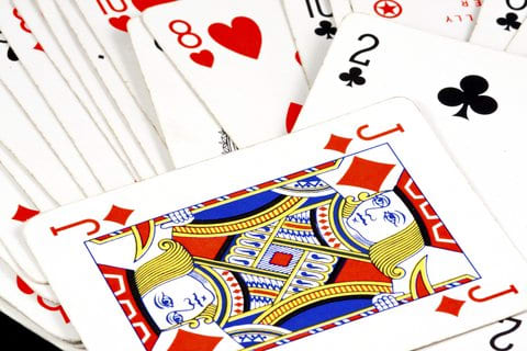 The two of clubs is a pick-up card! The next person misses a turn and must pick up two cards from the deck.