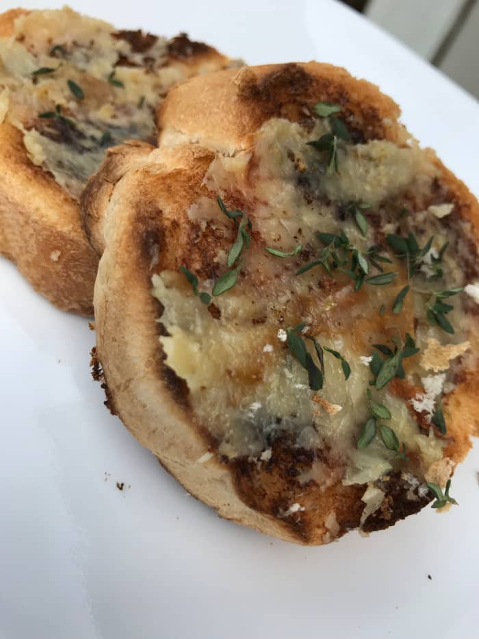 Glorious roasted garlic simply spread onto toasted French bread, and sprinkled with fresh thyme. Stunningly easy, and so delicious!
