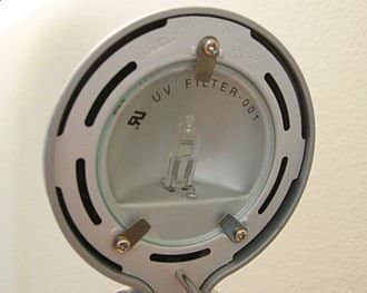 A Halogen lamp behind a round UV filter. A separate filter is included with some halogen light fixtures to remove UV light.