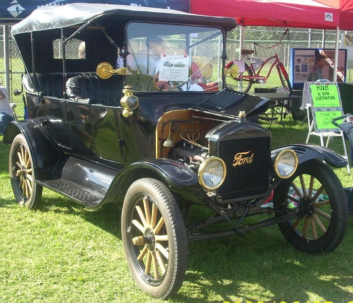 Henry's Car Changed History. This 1916 Model T still had some brass fixtures but not as much as earlier models. In later years, manufacturing methods improved and the car shed its brass frills. The price went lower and lower, to under $300.