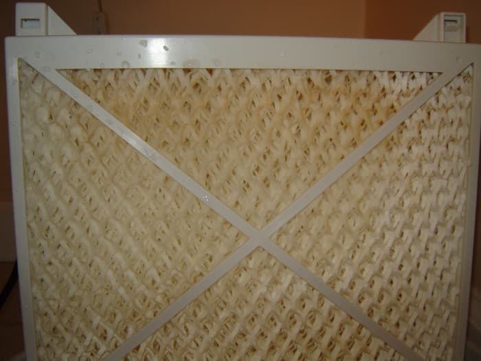 That's a modern humidifier filter after just a few days of use. Worse, it's after having just been cleaned with vinegar.