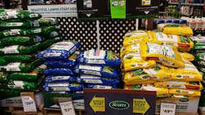 Big box garden centers push the use of high nitrogen fertilizers by stacking palettes high and offering sale prices.