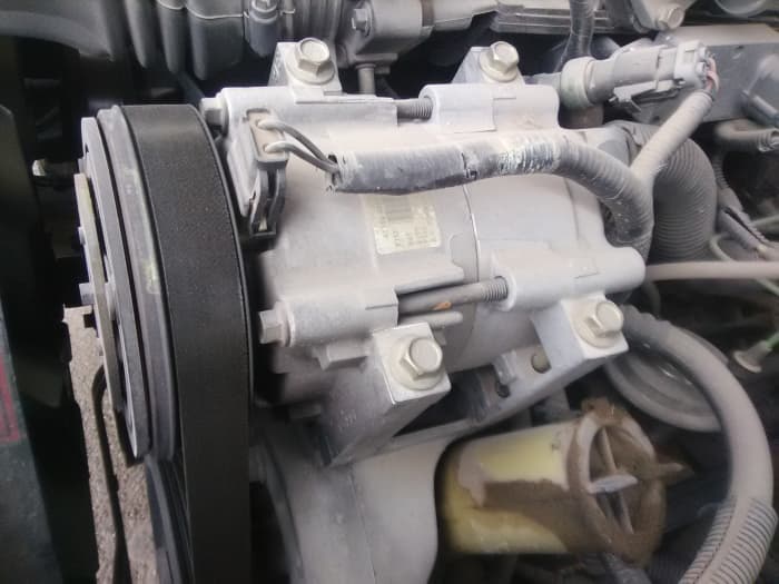 Check common sources of trouble that can cause a rough idle when AC is on.