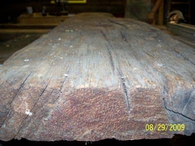 A 20' by 4" thick and 25" wide board reclaimed from the floor of an 1820 home.