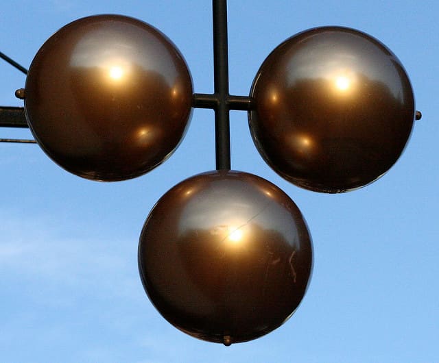 The three balls are the ages-old traditional symbol for a pawn shop; it stems from the days when a great many people could not read